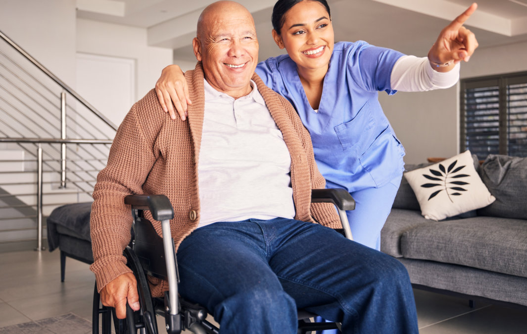 aide and senior woman smiling