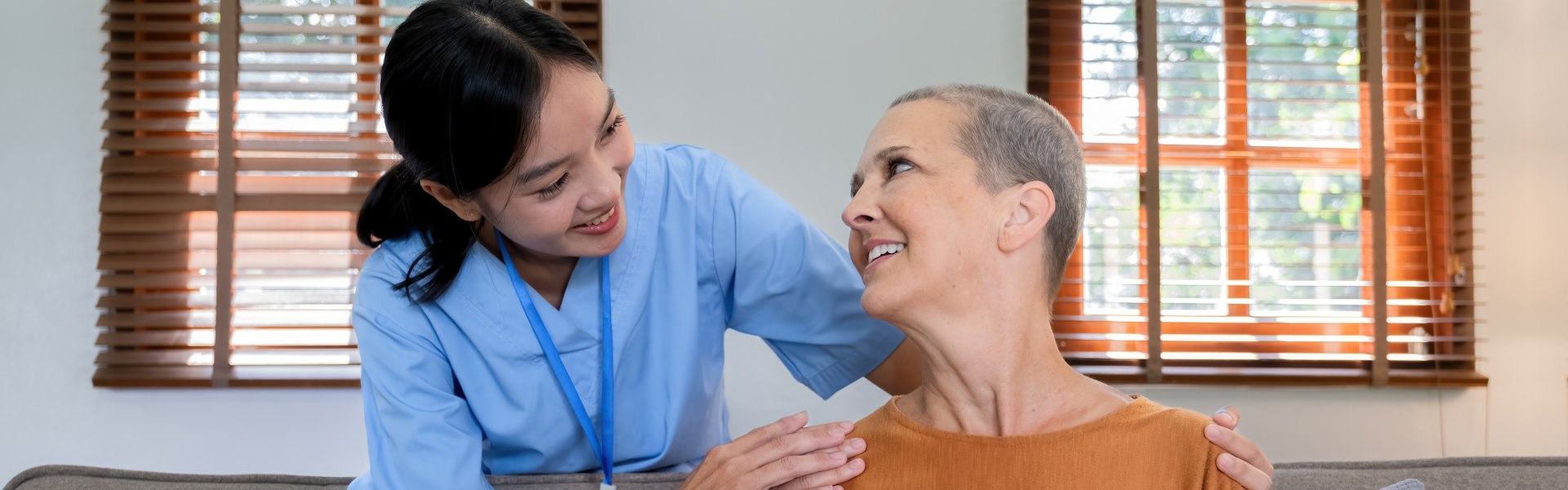 aide smiling at the senior woman