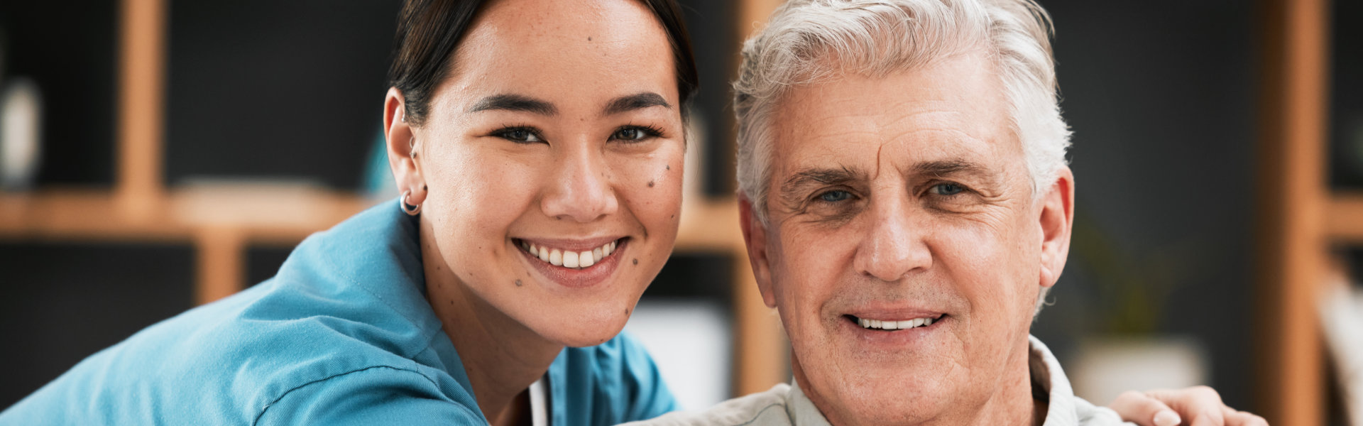 a woman and elderly woman smiling